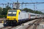 NMBS 2869 (ex NSR 186 119) schiebt ein EC (ex-IC Benelux) aus Rotterdam DCentraal nach Bruxelles-Midi am 11 Juli 2026.