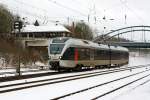   Der ET 22 2104 (94 80 0426 103-8 D-ABRN / 94 80 0826 103-4 D-ABRN), ex ET 22 004, ein 2-teiliger Stadler Flirt der Abellio Rail NRW, am 29.2.2014 kurz vor dem Bahnhof Kreuztal.