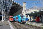 Unter der markanten Bahnhofshalle von Lyon Perrache mit dem passenden Turm im rechten Bildteil verlässt der SNCF 82621 verlässt den Bahnhof Richtung Bourg-en-Bresse, während im