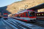   Der MGB ABDeh 4/10 „KOMET“ ein Stadler Niederflur-Panoramatriebzug mit Zahnrad- und Adh�sionsantrieb steht am 30.12.2015 als Regionalzug im Bahnhof  Brig (Bahnhofsvorplatz) zur Abfahrt