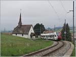 Der TPF RABe 527 193 ist bei Vaulruz als RE nach Fribourg unterwegs.